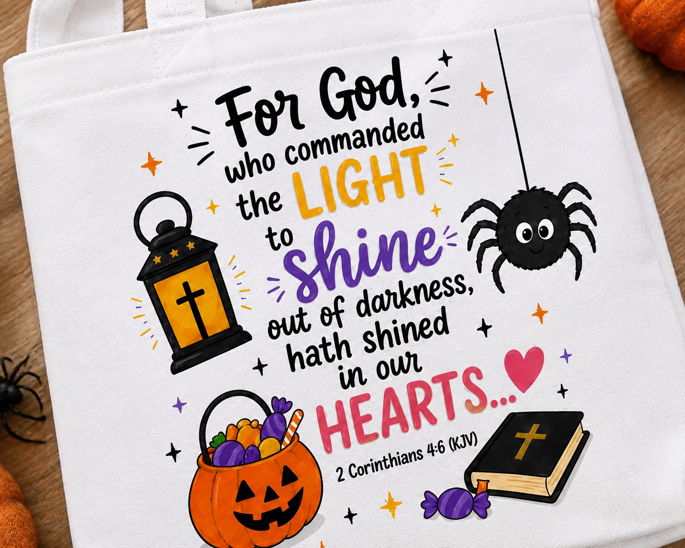 Close-up of Christian kids tote bag featuring lantern, pumpkin, Bible, and 2 Corinthians 4:6 KJV Scripture design.