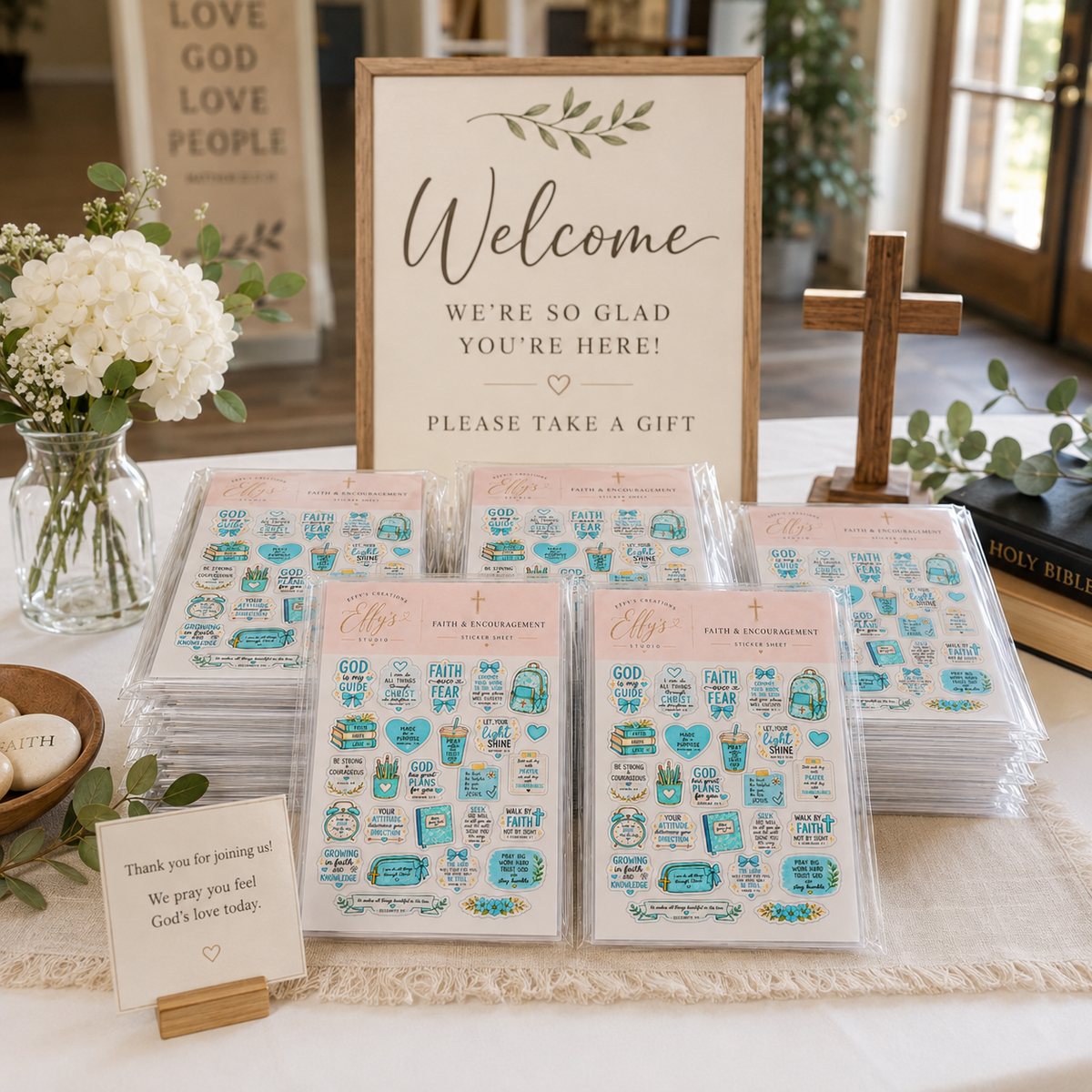 Christian sticker sheets displayed on a church welcome table for Bible study gifts, women’s ministry and event giveaways