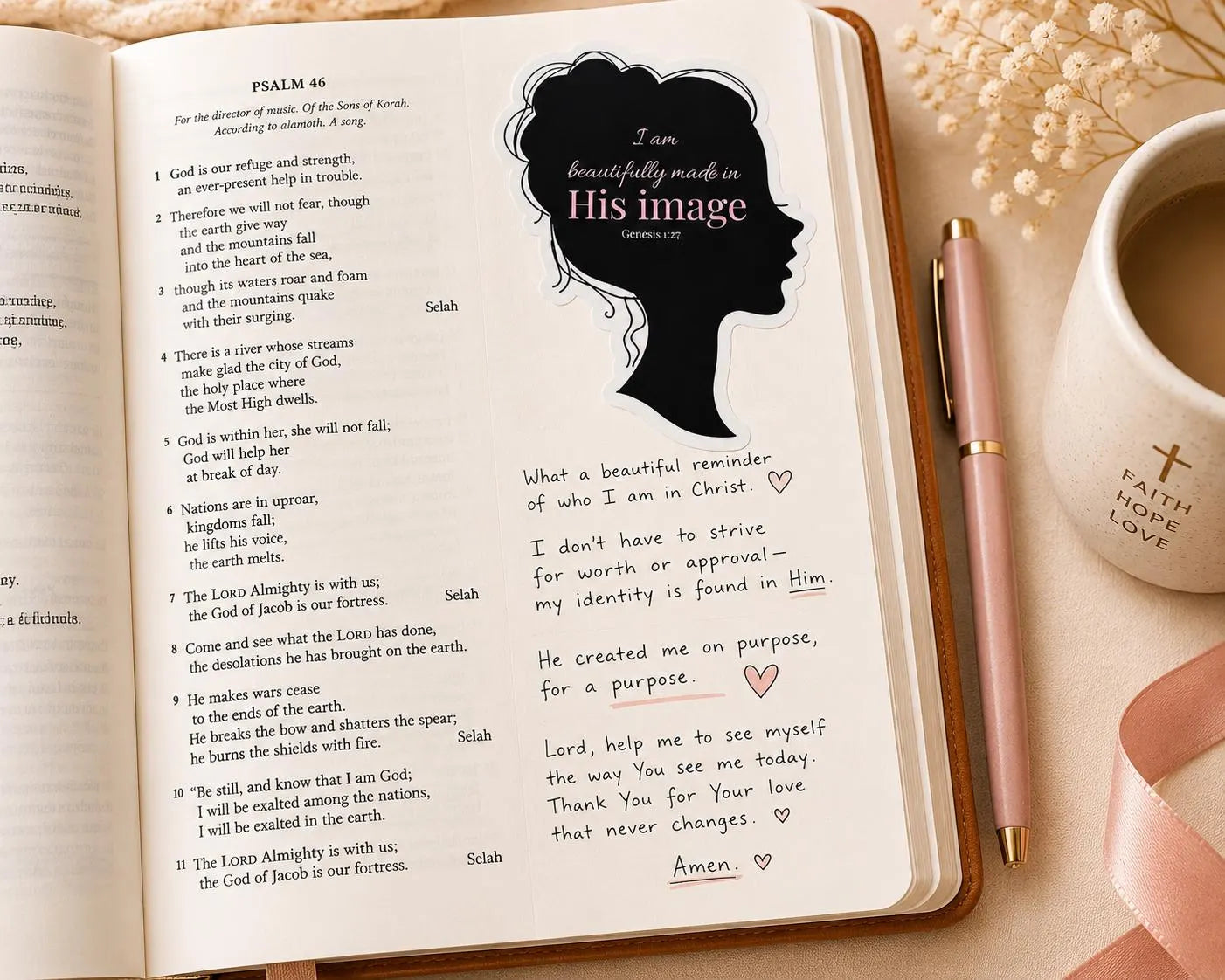 Genesis 1:27 Christian sticker displayed beside an open Bible for Bible journaling